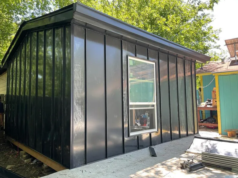 Black standing seam metal wall panels for Roof Inspection in Stillwater